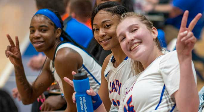 GHC Women's Basketball teammates waving to the camera.