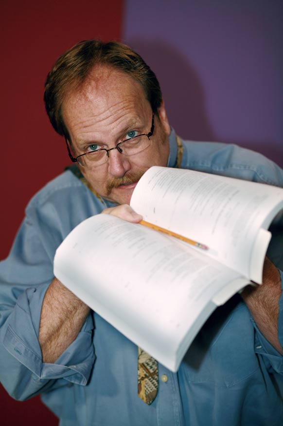 image of Dr. Hershey holding a literature book
