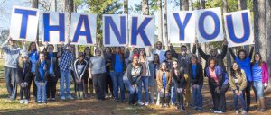 Students holding up Thank you sign