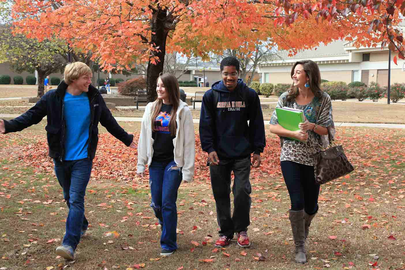 Student walking in the autumn leaves