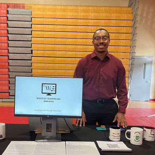 Dakota at a booth representing his IT company, Whatley Technology Services