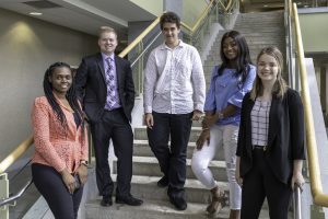 Winners of our Annual Values Award standing on stairwell