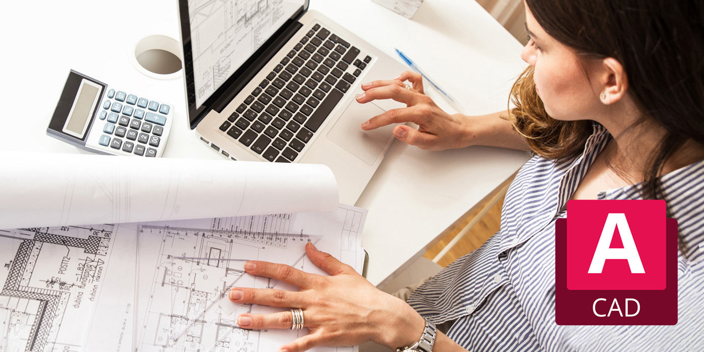 Woman reviewing schematics and using AutoCAD software