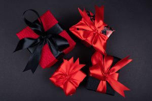 black and red wrapped presents with ribbons