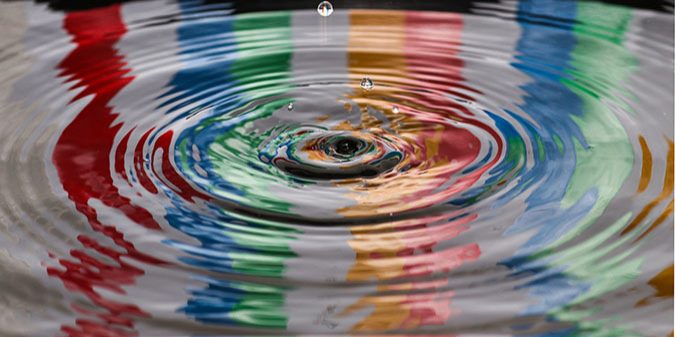 a marble causing ripples in water
