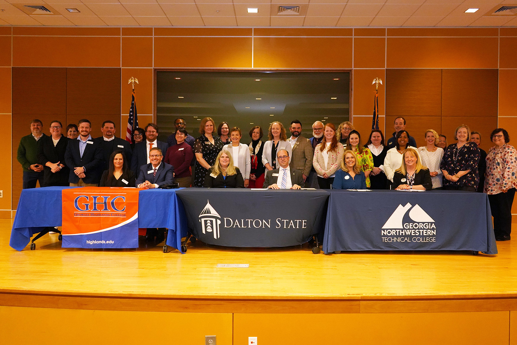 Group photo of articulation agreement signing