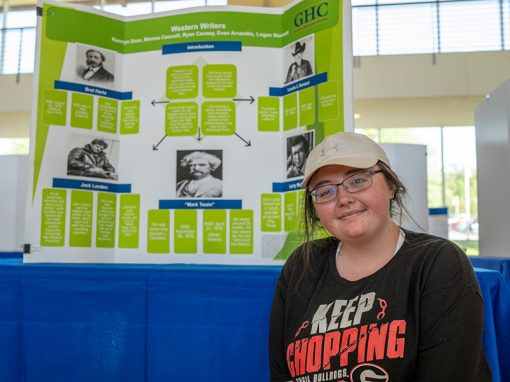 student with a poster