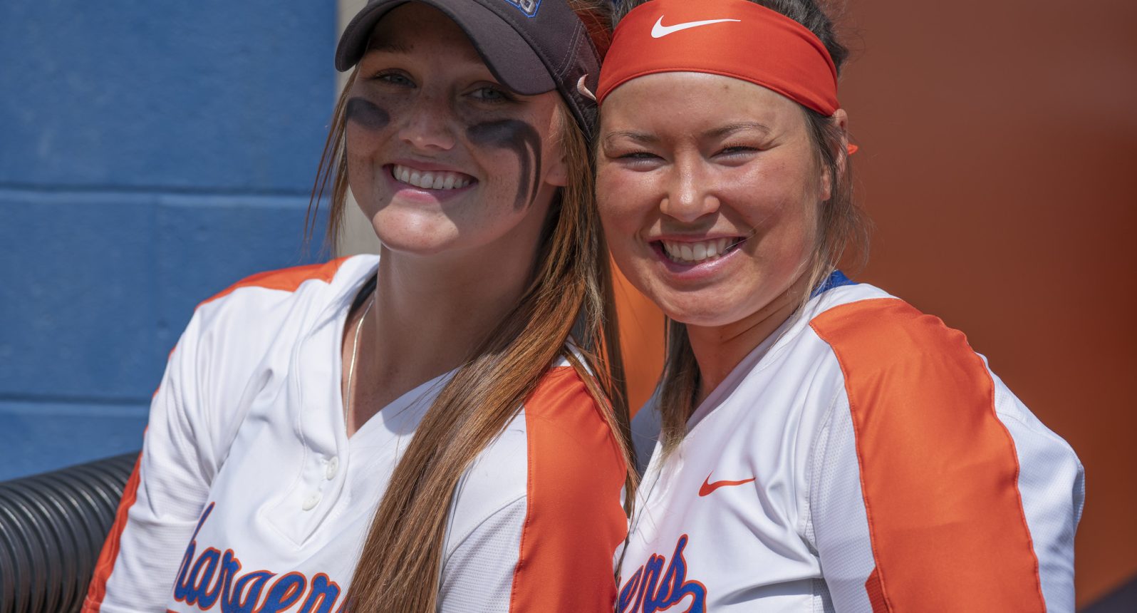 Two GHC softball players smiling at camera.