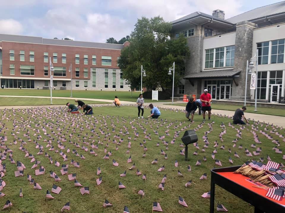 Students placing the flags