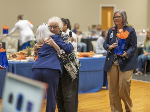 two nurses hugging in celebration of 50 years of nursing at ghc