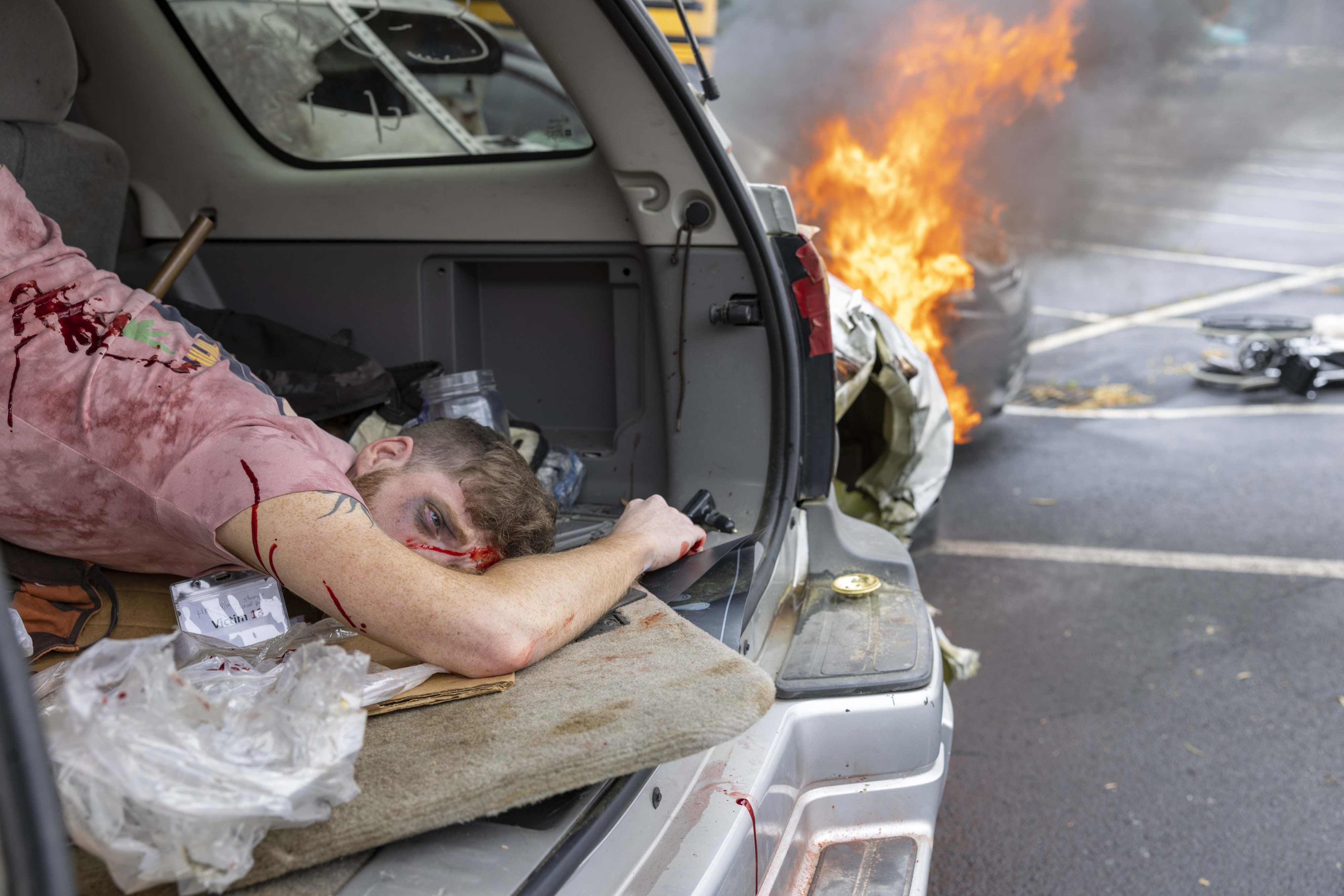 Actor portraying victim during disaster simulation