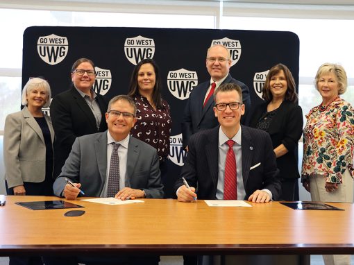 L to R, front row: Dr. Mike Hobbs, GHC president; Dr. Brendan Kelly, UWG president. L to R, back row: Dr. Paula Stover, GHC director of nursing; Dr. Lisa Jellum, GHC School of Health Sciences dean; Dr. Sarah Coakley, GHC provost and chief academic officer; Dr. Jon Preston, UWG provost and senior vice president for academic affairs; Dr. Jenny Schuessler, UWG Tanner Health System School of Nursing dean; and Sally Richter, UWG interim associate dean of nursing graduate programs