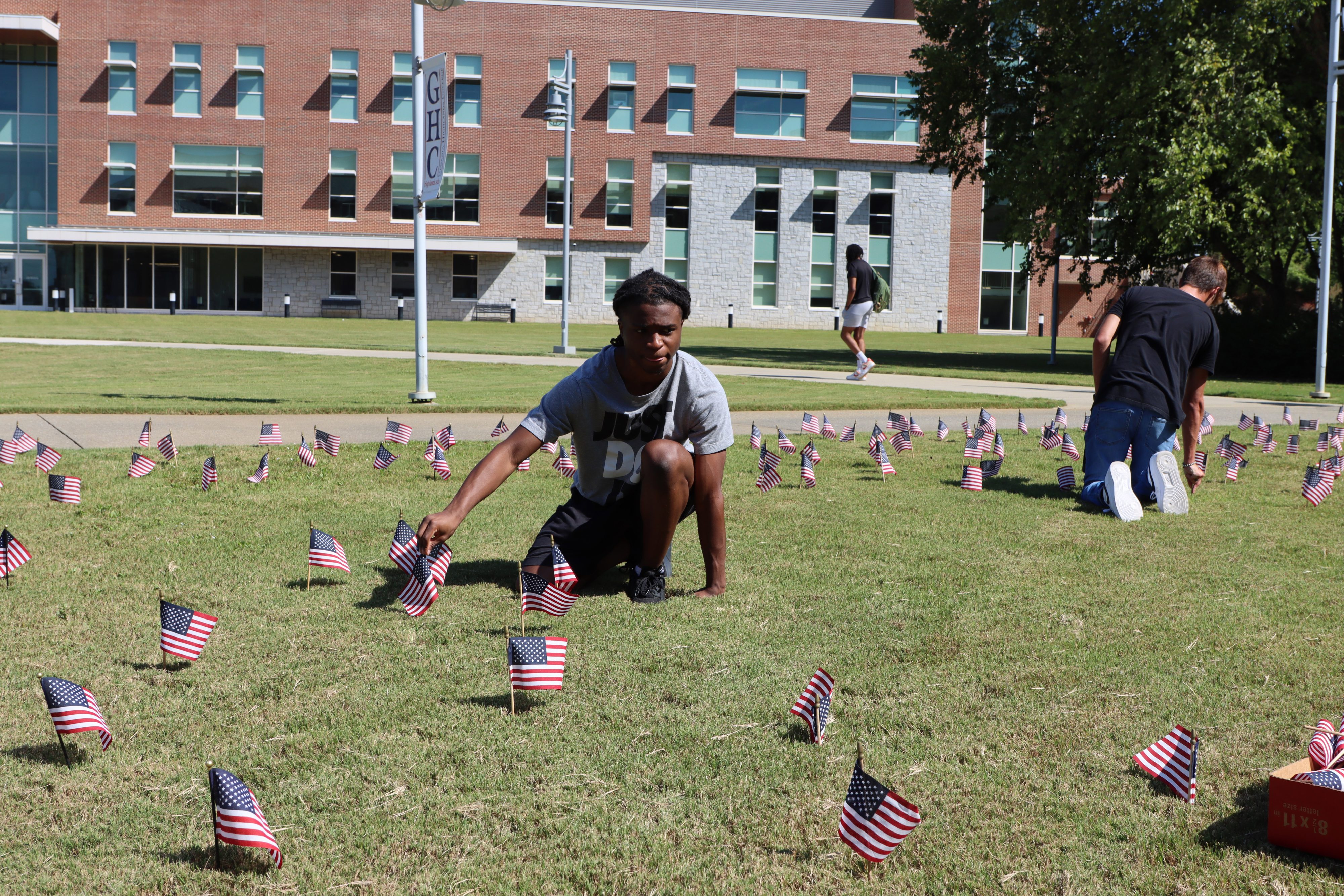 Student placing flags.