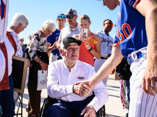 Cdr. Robery Bently USN (Ret) shaking hands with a Charger baseball player