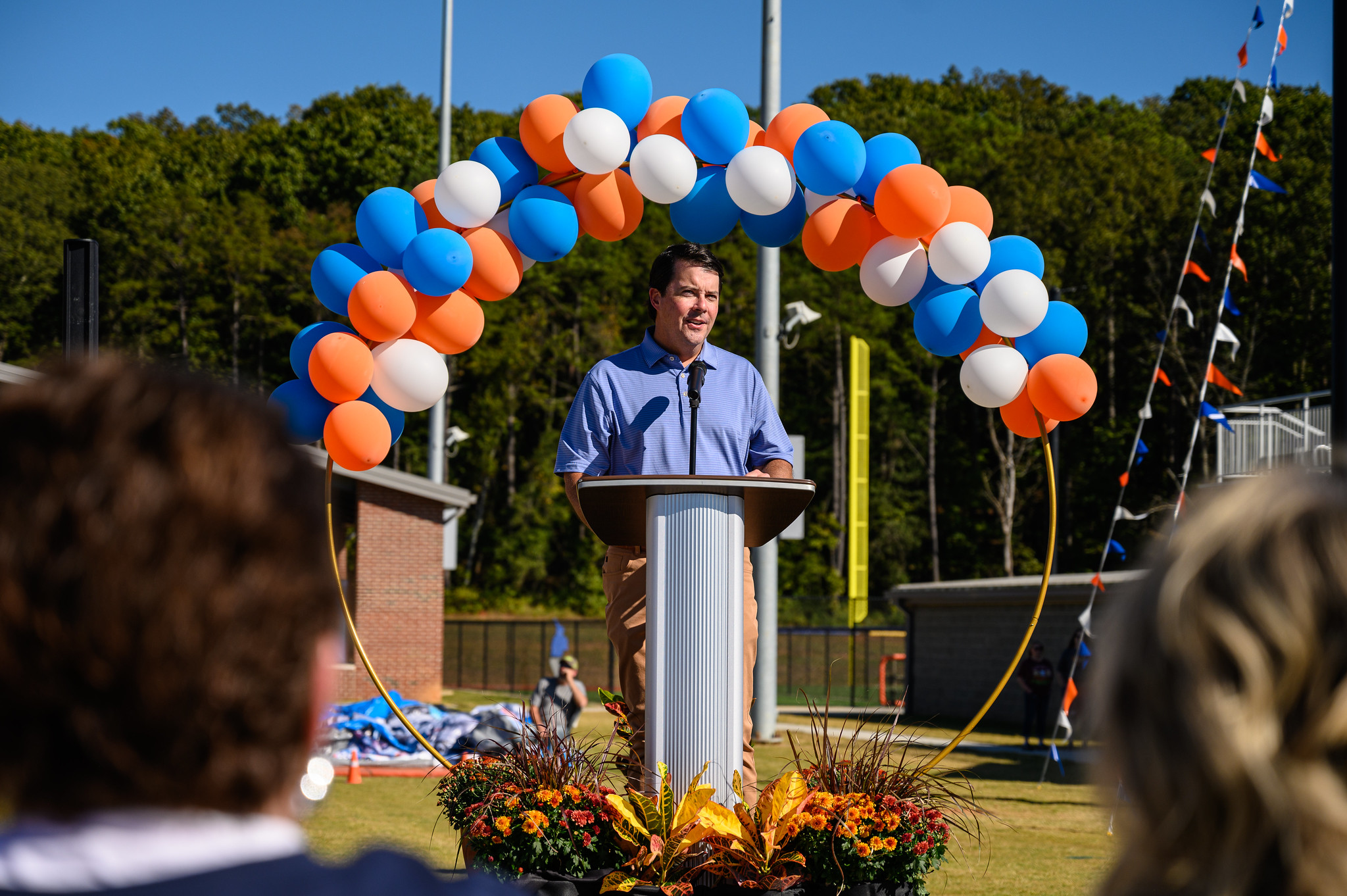 Speaker at field naming celebration.