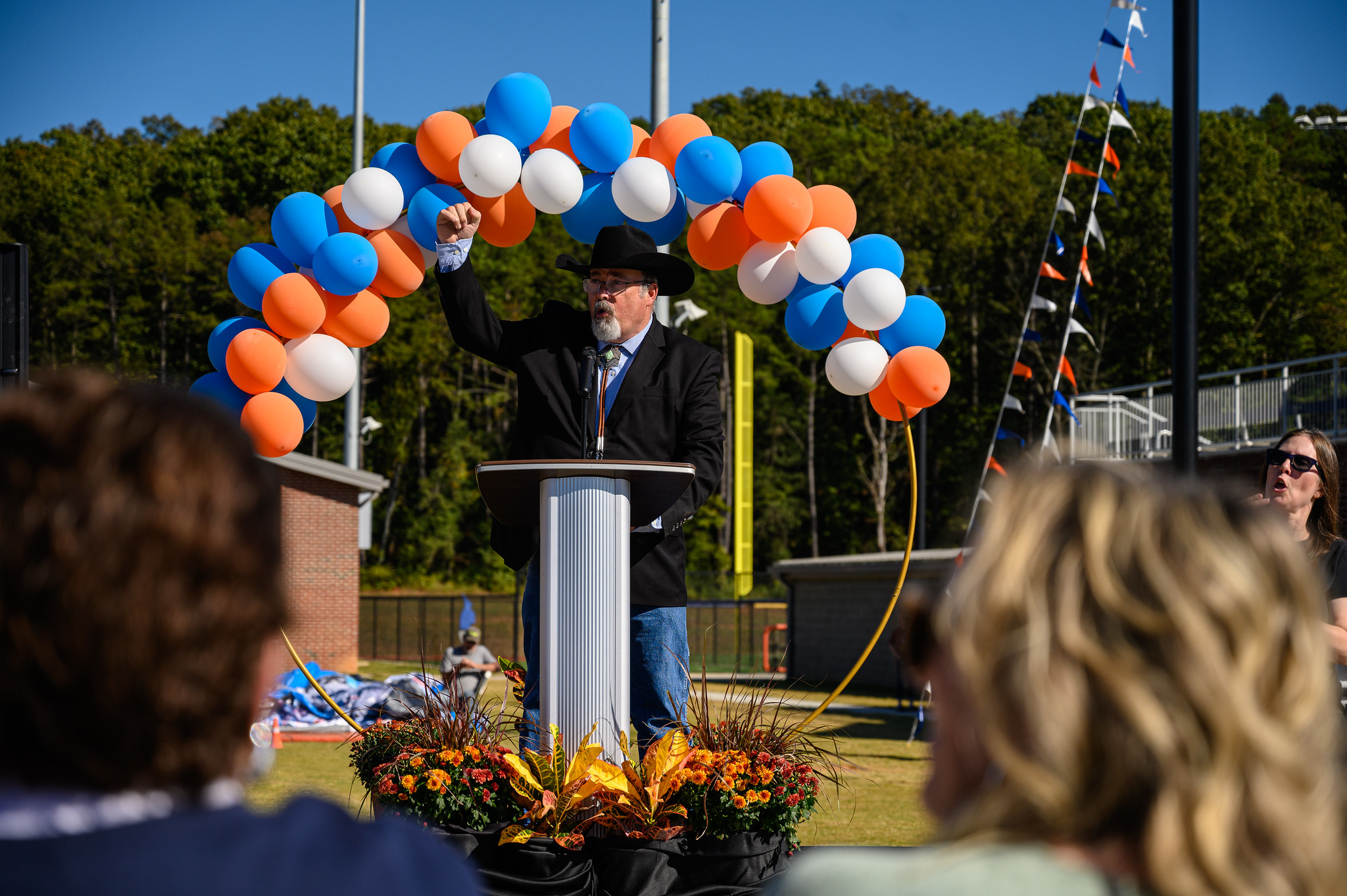 Speaker at field naming celebration.