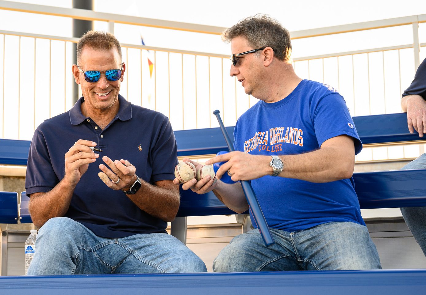 MLB World Series winning pitcher Mark Wohlers signing a baseball.