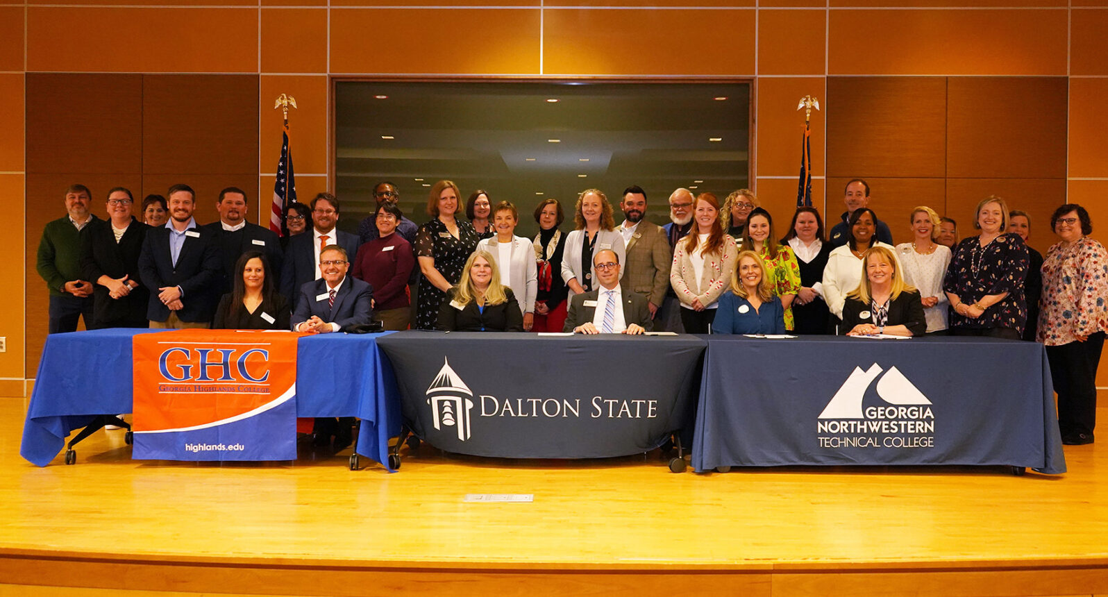 Group photo of articulation agreement signing