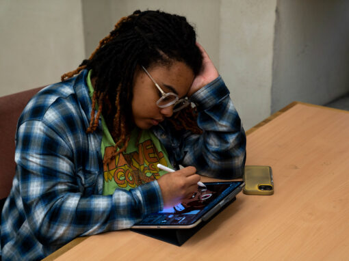 GHC student works on her tablet.