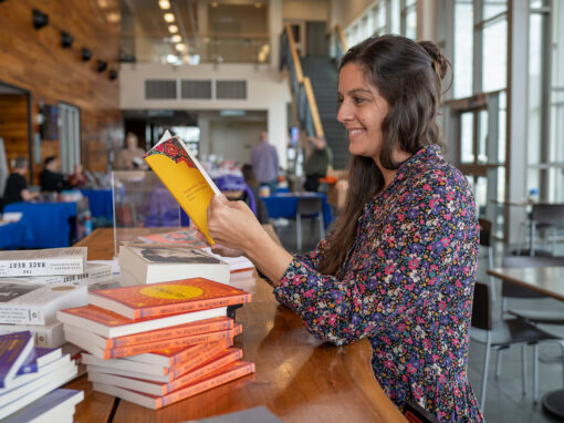 Image of woman reading a book at the Highlands Writers Conference