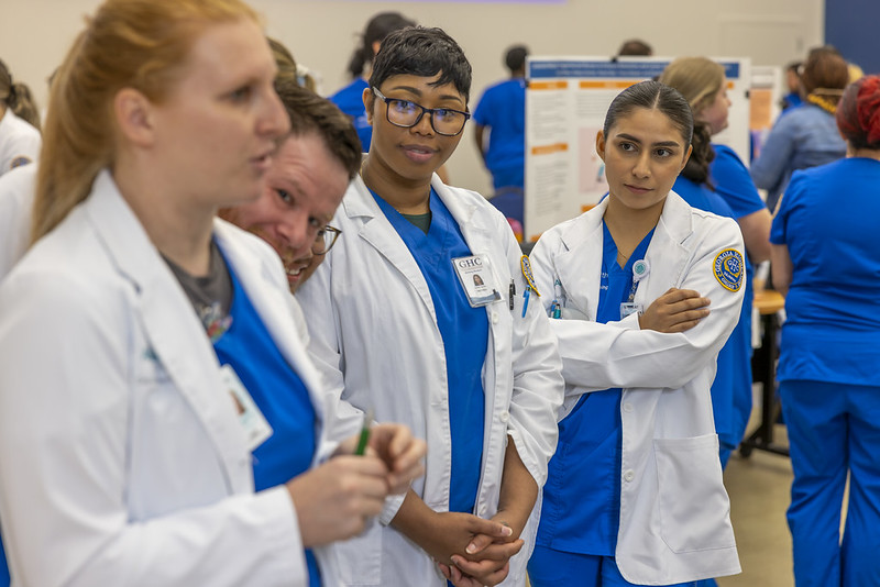 Student and instructor looking over an assignment