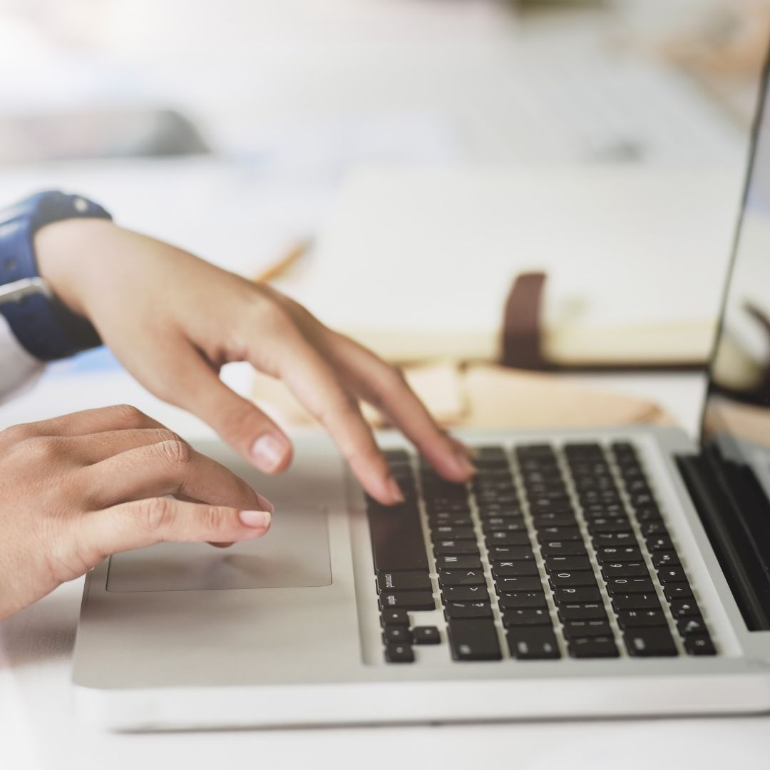 typing on laptop