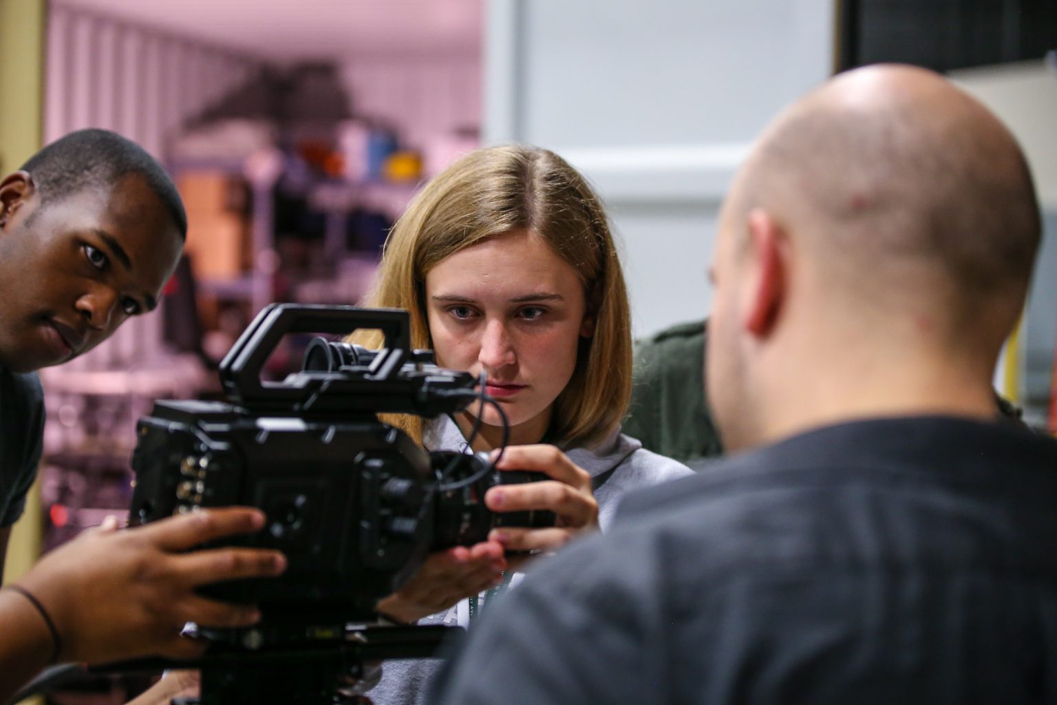 Georgia Film Academy students adjust a camera