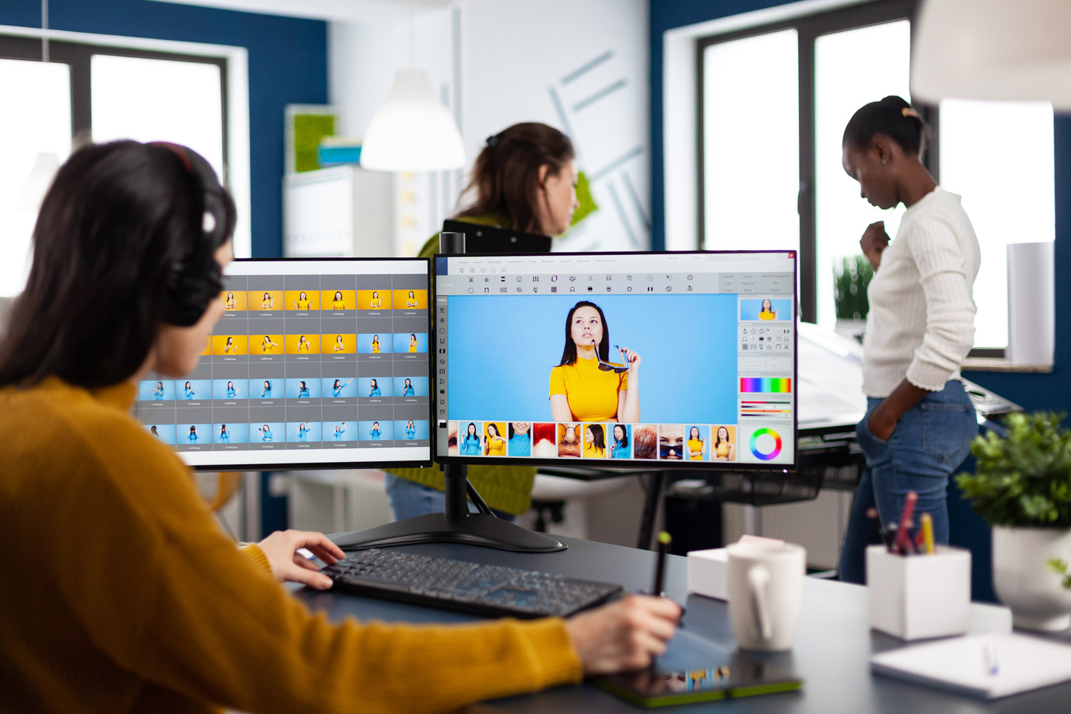 Professional photographer editing at his desk.