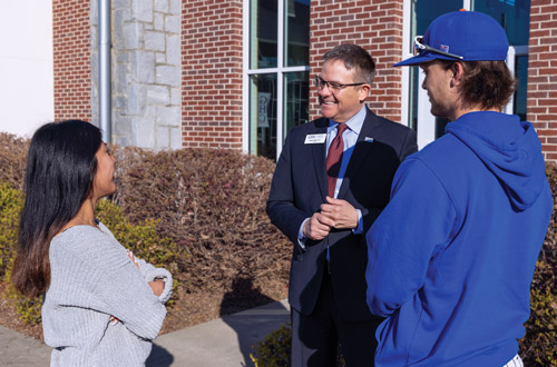 Dr. Hobbs speaking with students