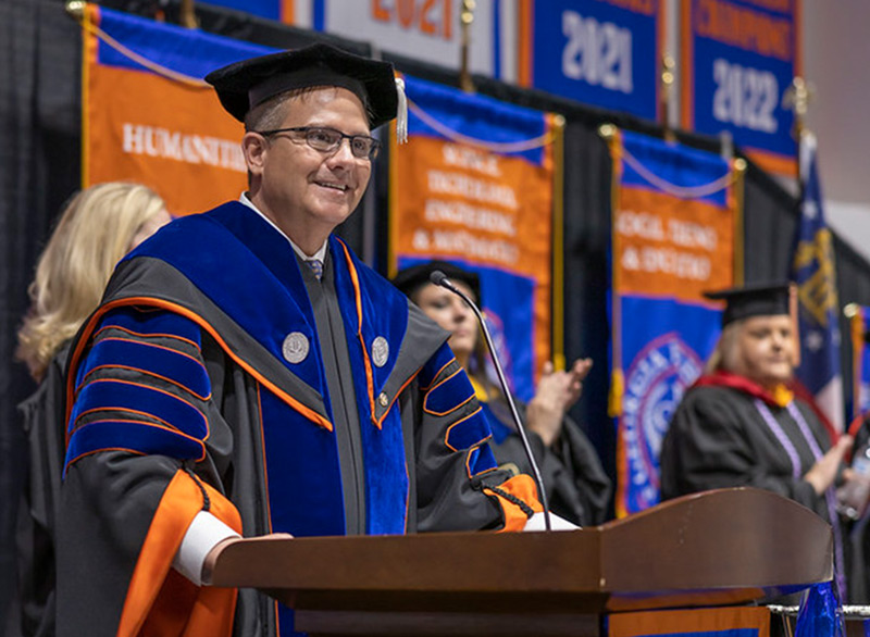 President Mike Hobbs at lectern