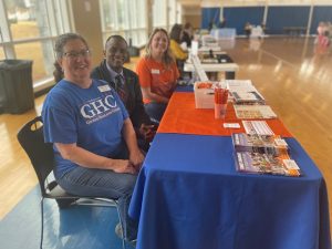 SSS staff at Bartow County Transition Fair sitting at GHC table. 